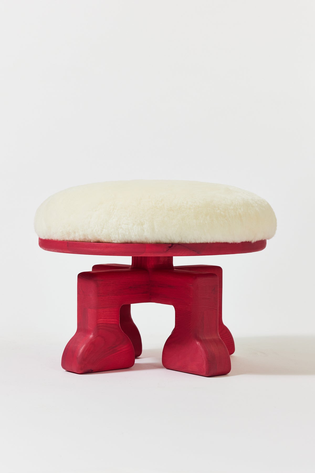 Muffin Man Stool in Raspberry Pink Ash with white shearling seat. Handmade solid wood stool with shearling seat by Phillip's Daughter