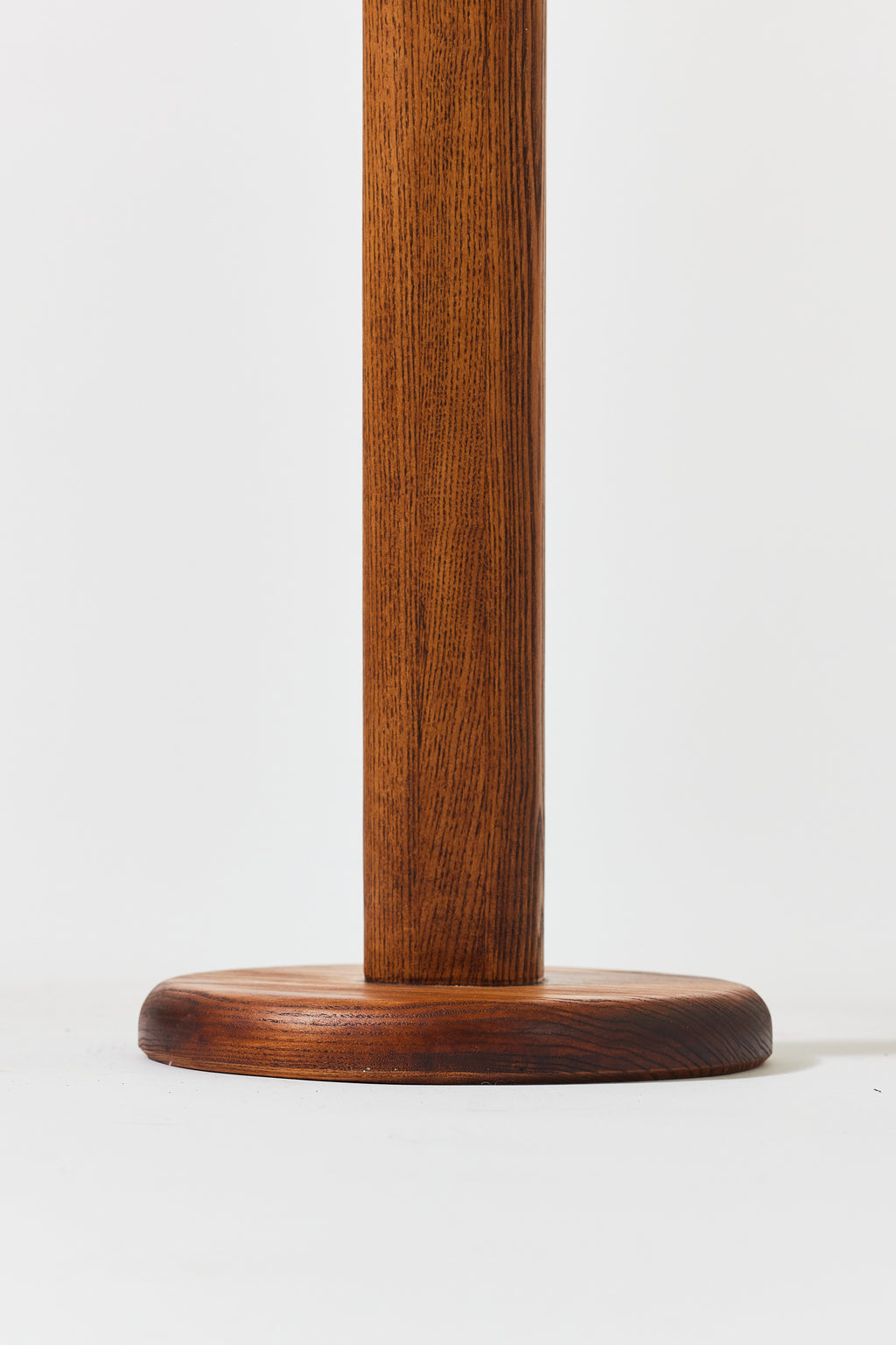 Florian Table with small top in Caramel Ash, detail view 2. Handmade round wooden pedestal side table by Phillip's Daughter