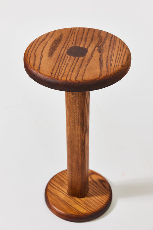Florian Table with small top in Caramel Ash, alternate view. Handmade round wooden pedestal side table by Phillip's Daughter