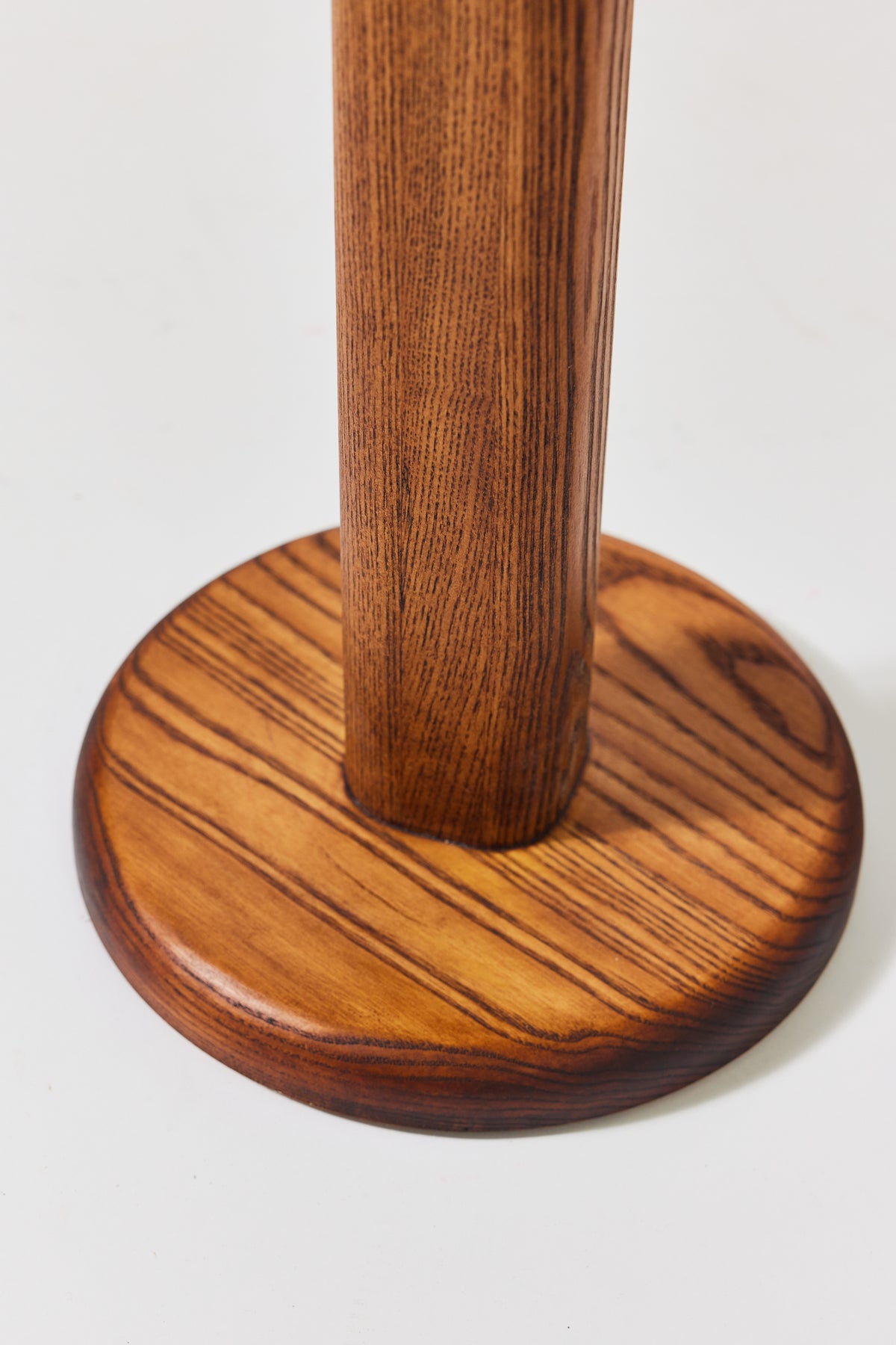 Florian Table with small top in Caramel Ash, detail view 4. Handmade round wooden pedestal side table by Phillip's Daughter