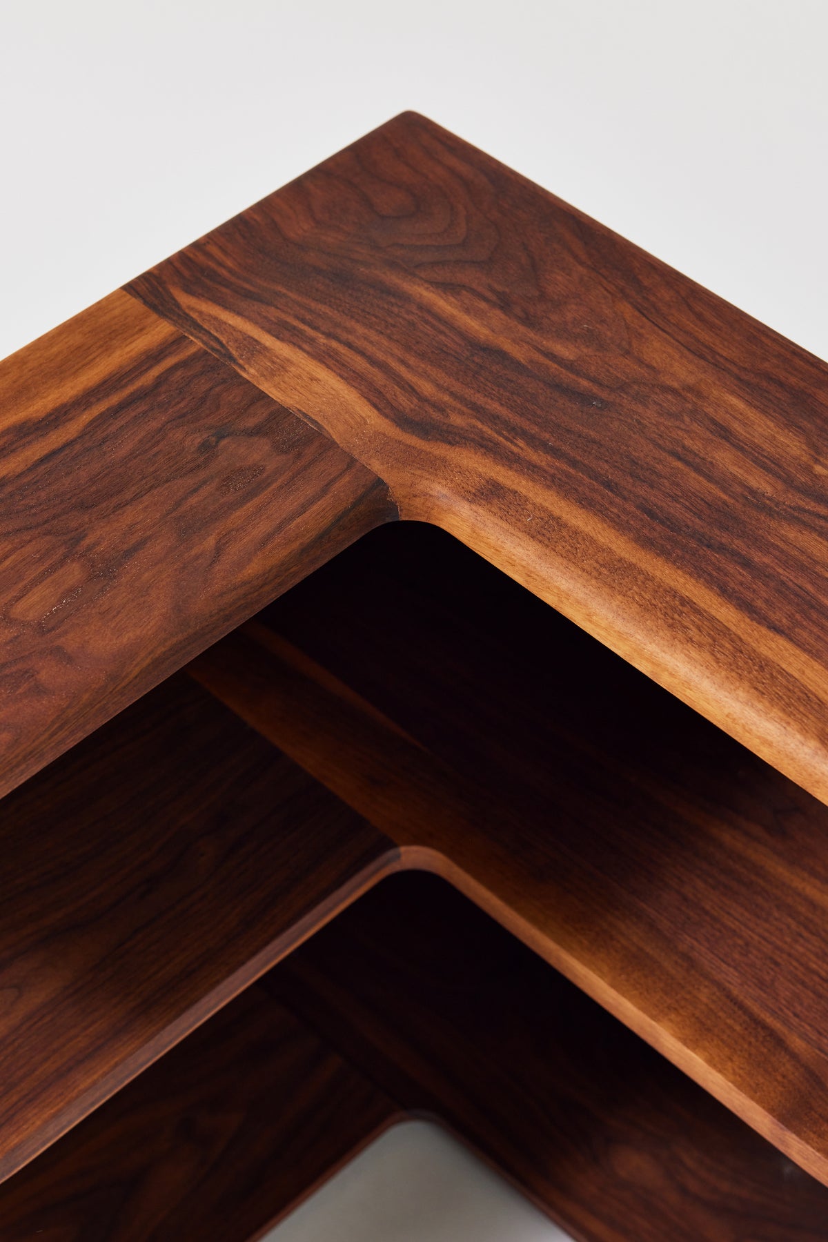 Cornelius Corner Shelf in solid walnut, detail view 2. Handmade wooden corner shelf by Phillip's Daughter