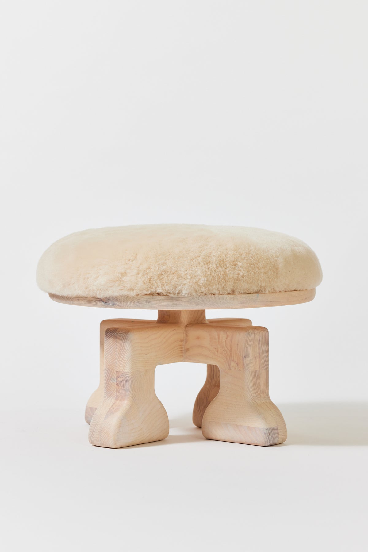 Muffin Man Stool in Chalk Ash with putty shearling seat. Handmade solid wood stool with shearling seat by Phillip's Daughter