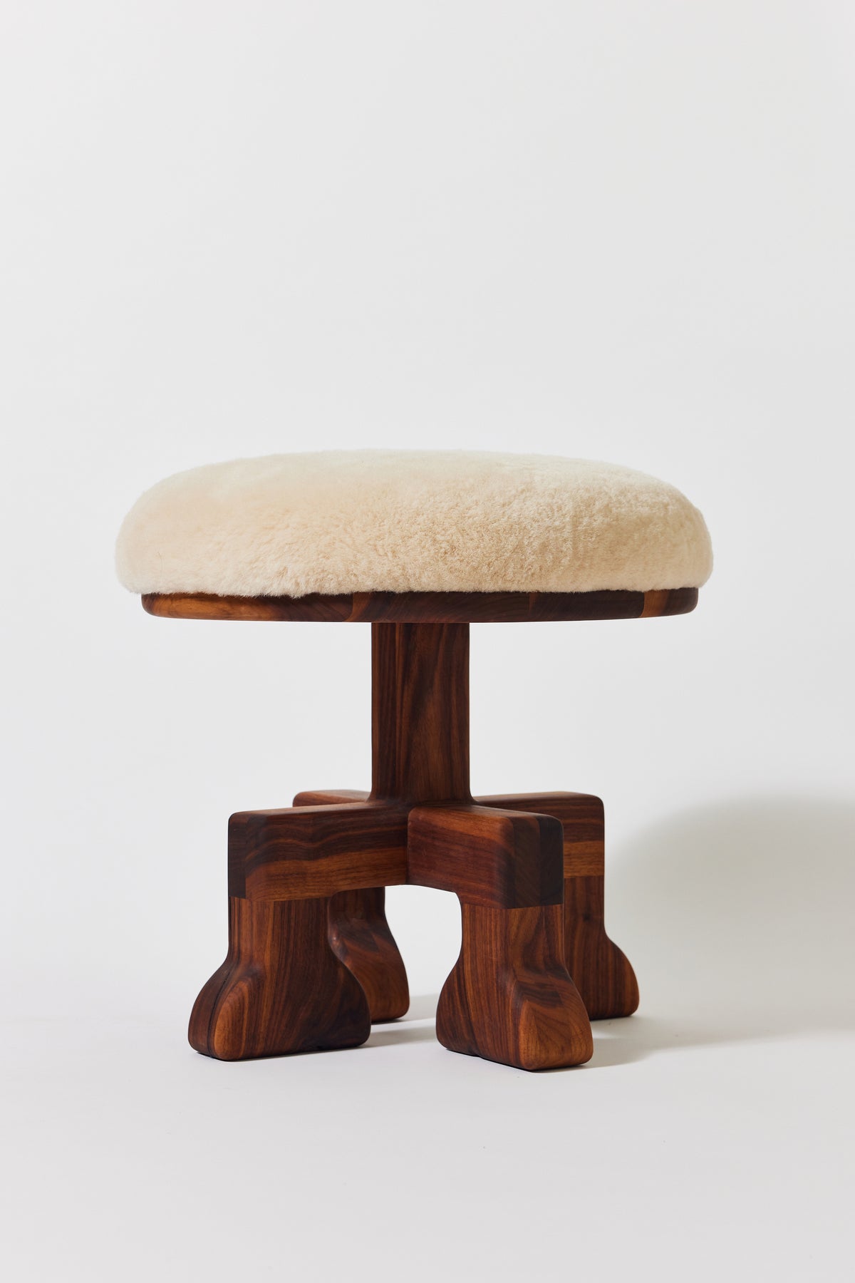 Muffin Man Tall stool in solid walnut with putty shearling seat. Handmade tall solid wood stool with shearling seat by Phillip's Daughter