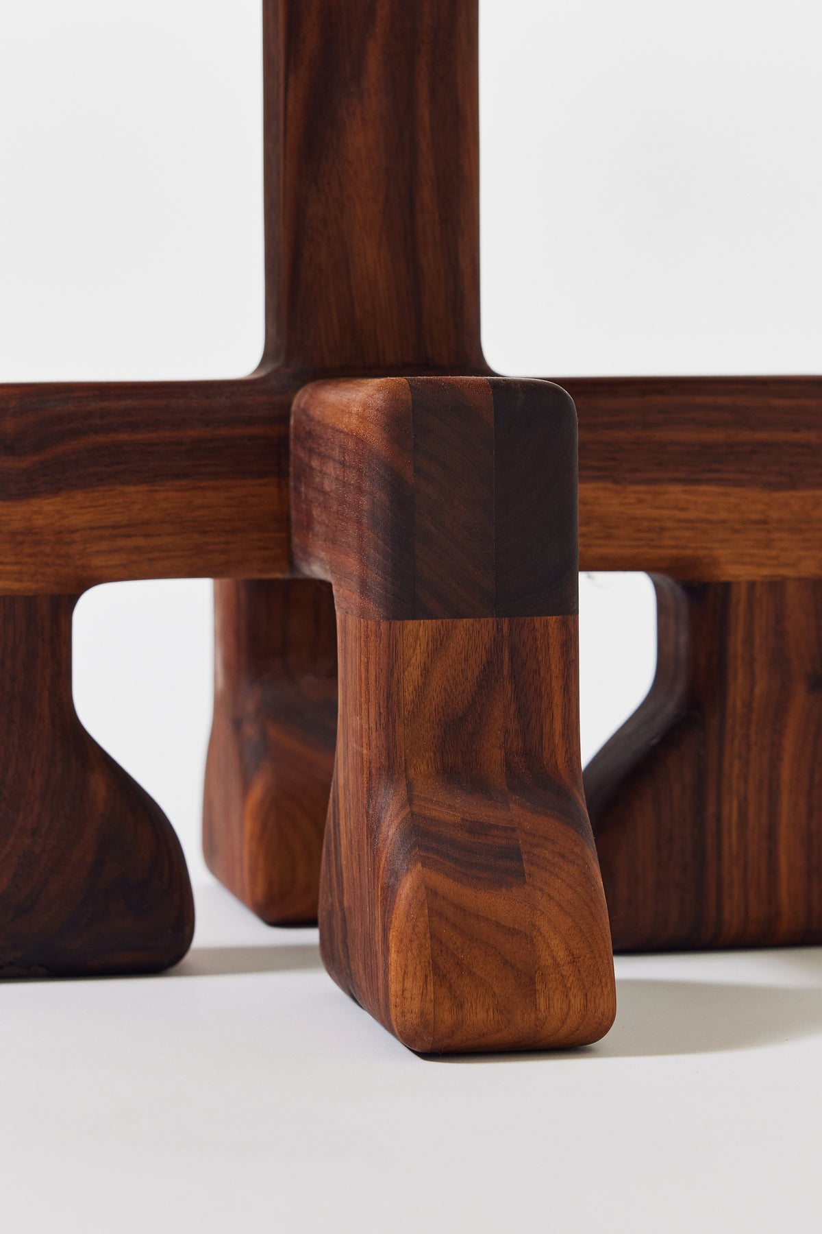 Muffin Man Tall stool in solid walnut with putty shearling seat, detail view 4. Handmade tall solid wood stool with shearling seat by Phillip's Daughter