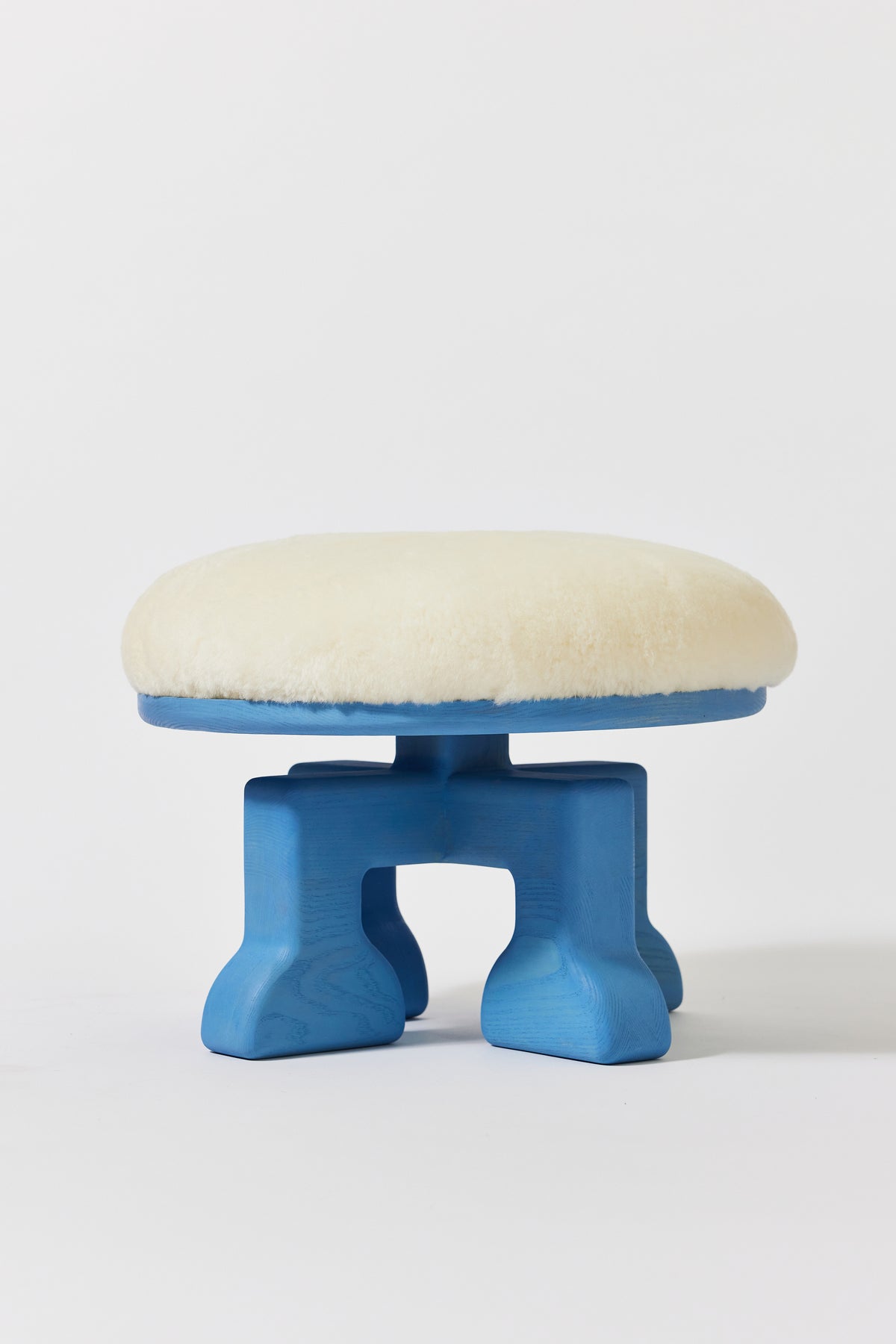 Muffin Man Stool in Light Blue Ash with white shearling seat. Handmade solid wood stool with shearling seat by Phillip's Daughter