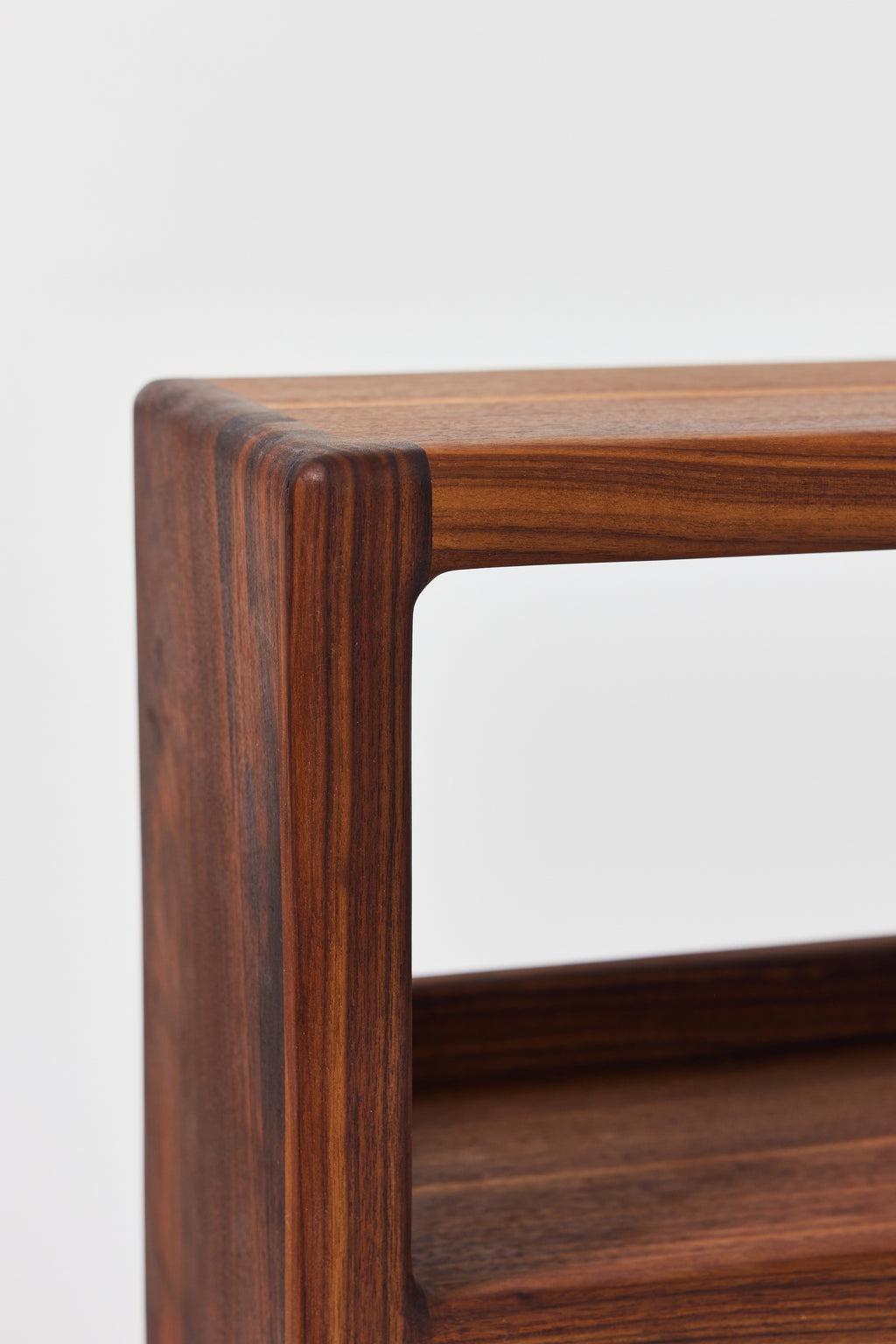 Julius Short Shelf in solid walnut, alternate view. Handmade low wooden bookshelf by Phillip's Daughter