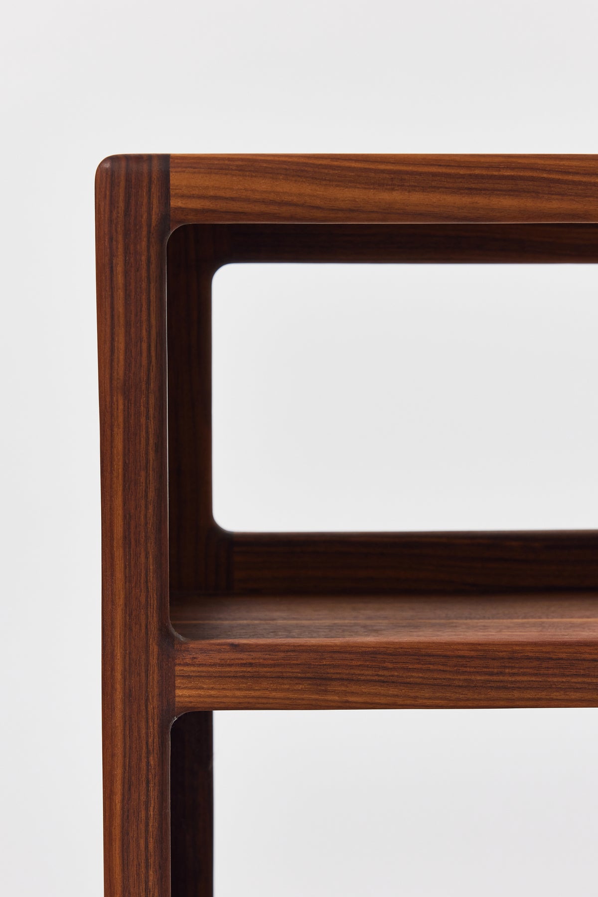 Julius Short Shelf in solid walnut, detail view 2. Handmade low wooden bookshelf by Phillip's Daughter