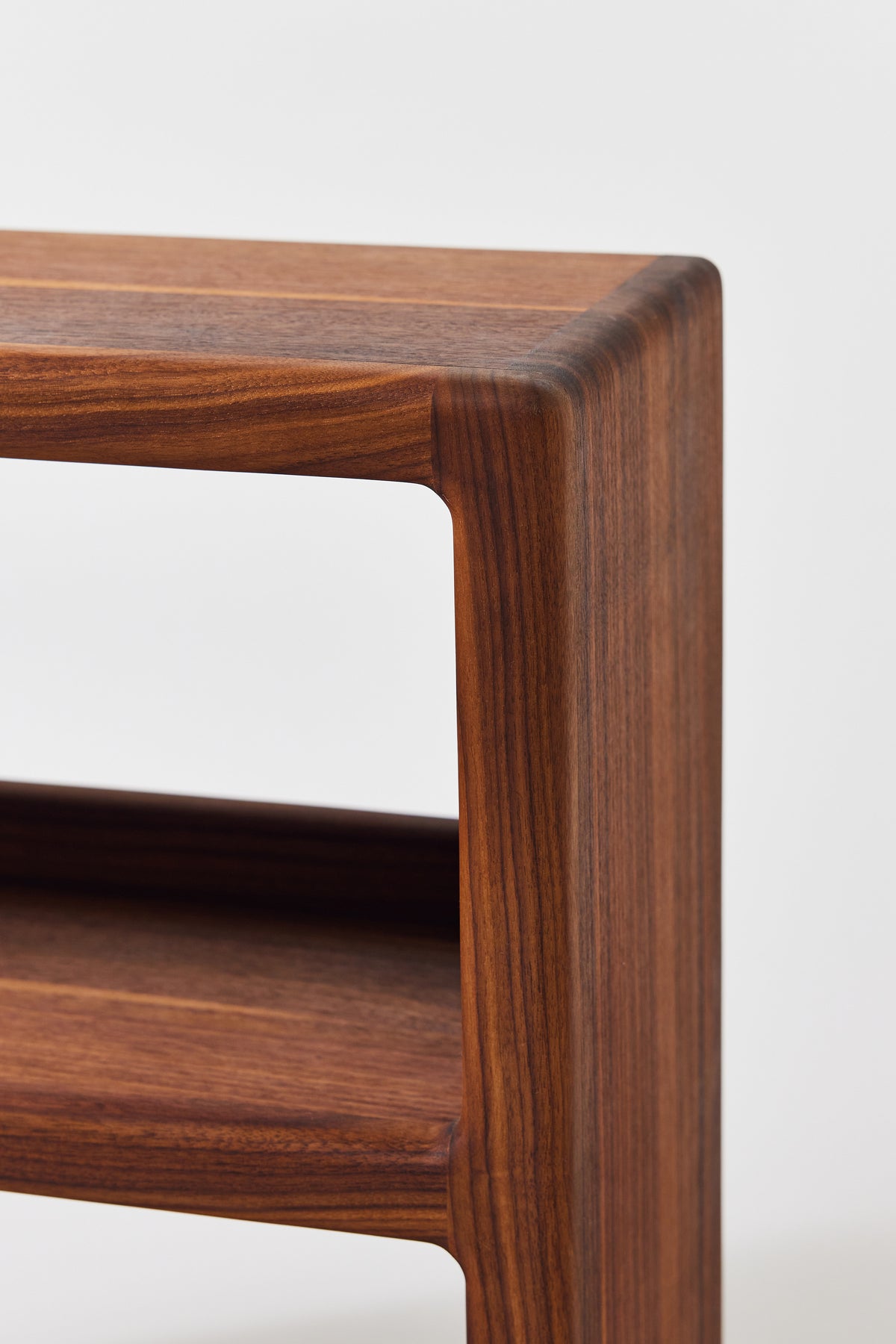 Julius Short Shelf in solid walnut, detail view 3. Handmade low wooden bookshelf by Phillip's Daughter