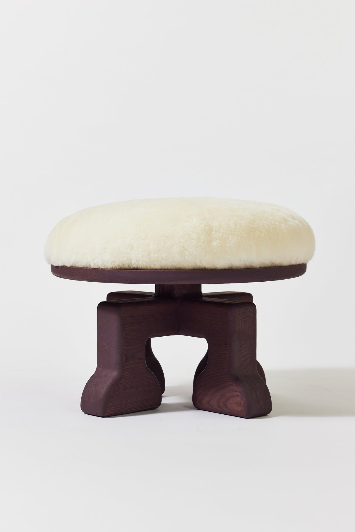 Muffin Man Stool in Eggplant Ash with white shearling seat. Handmade solid wood stool with shearling seat by Phillip's Daughter