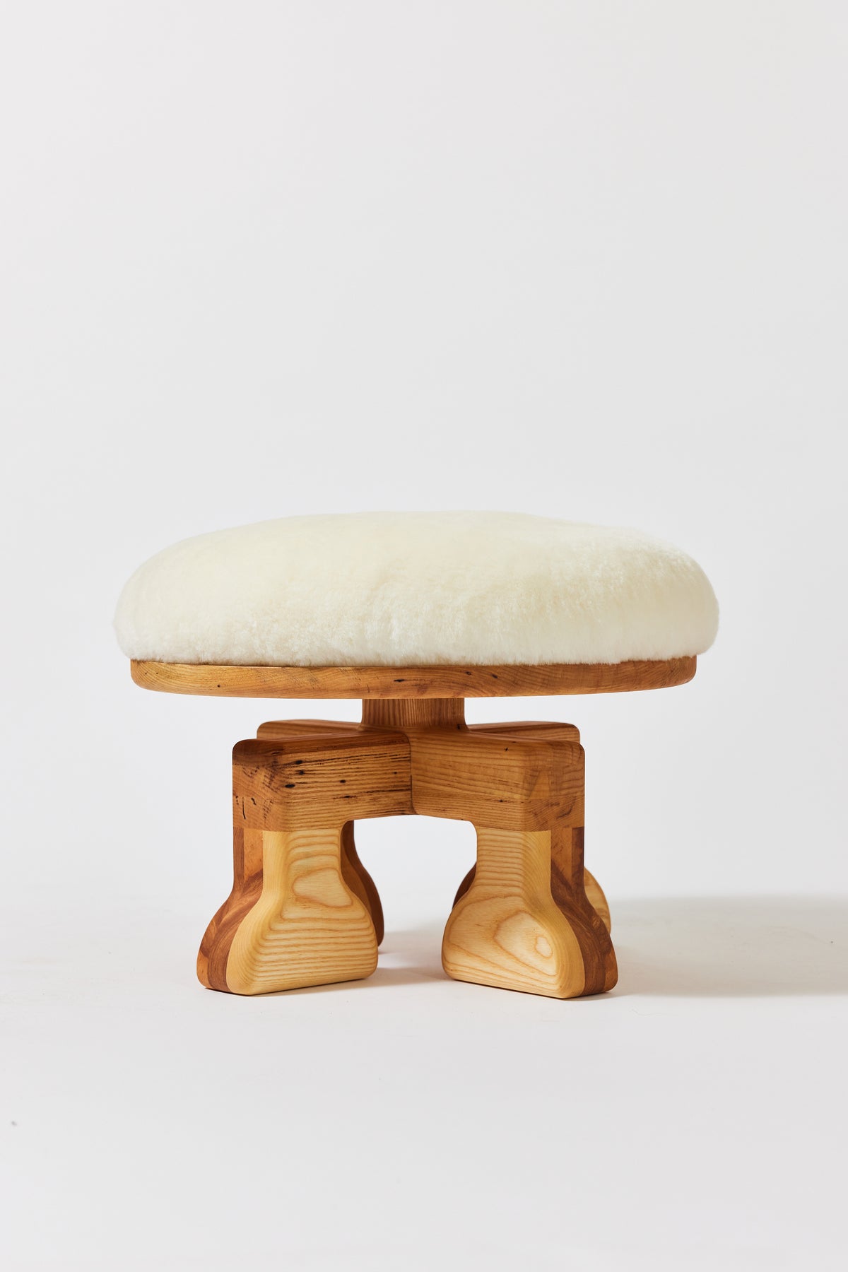 Muffin Man Stool in Natural Ash with white shearling seat. Handmade solid wood stool with shearling seat by Phillip's Daughter