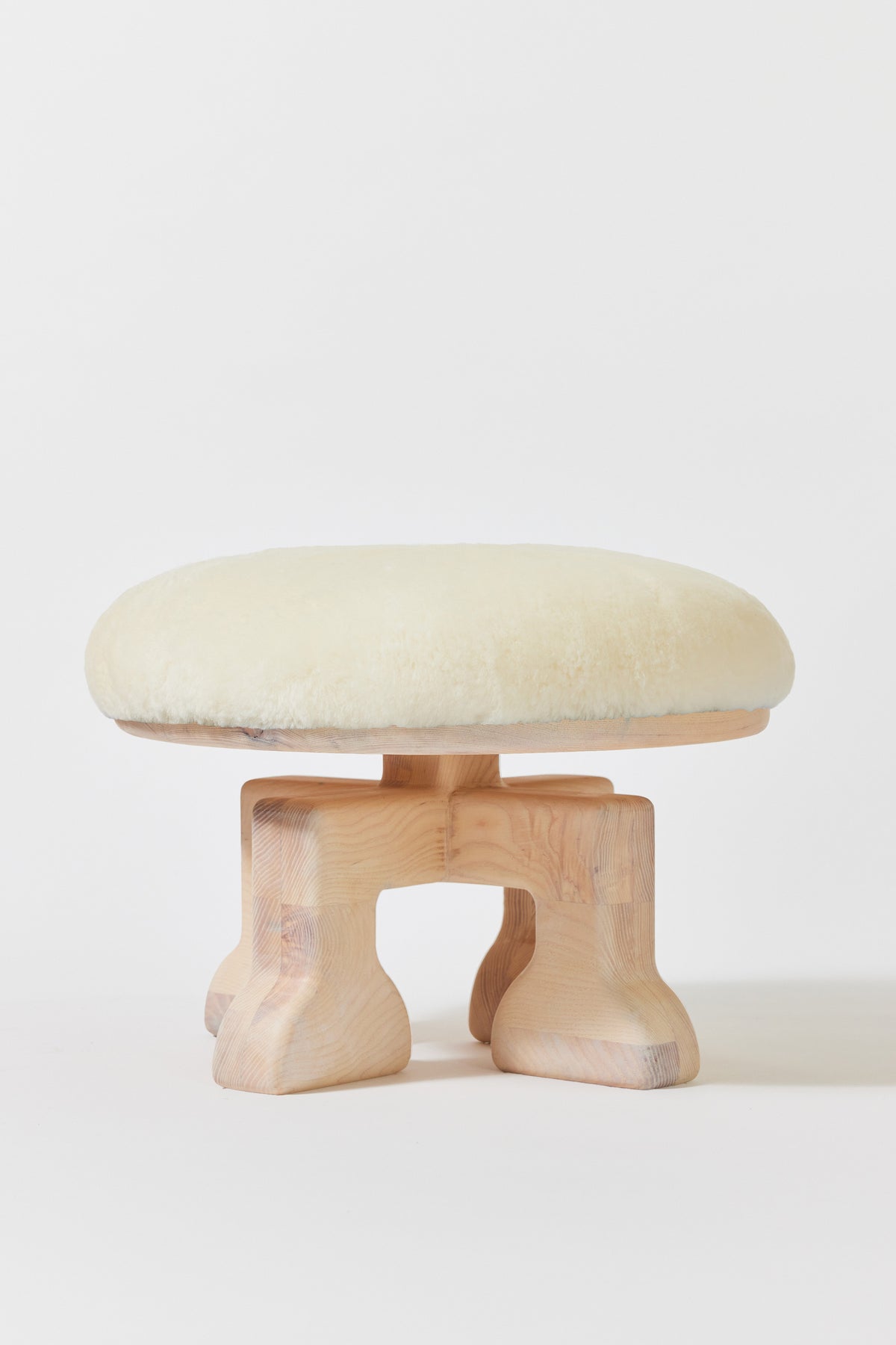 Muffin Man Stool in Chalk Ash with white shearling seat. Handmade solid wood stool with shearling seat by Phillip's Daughter