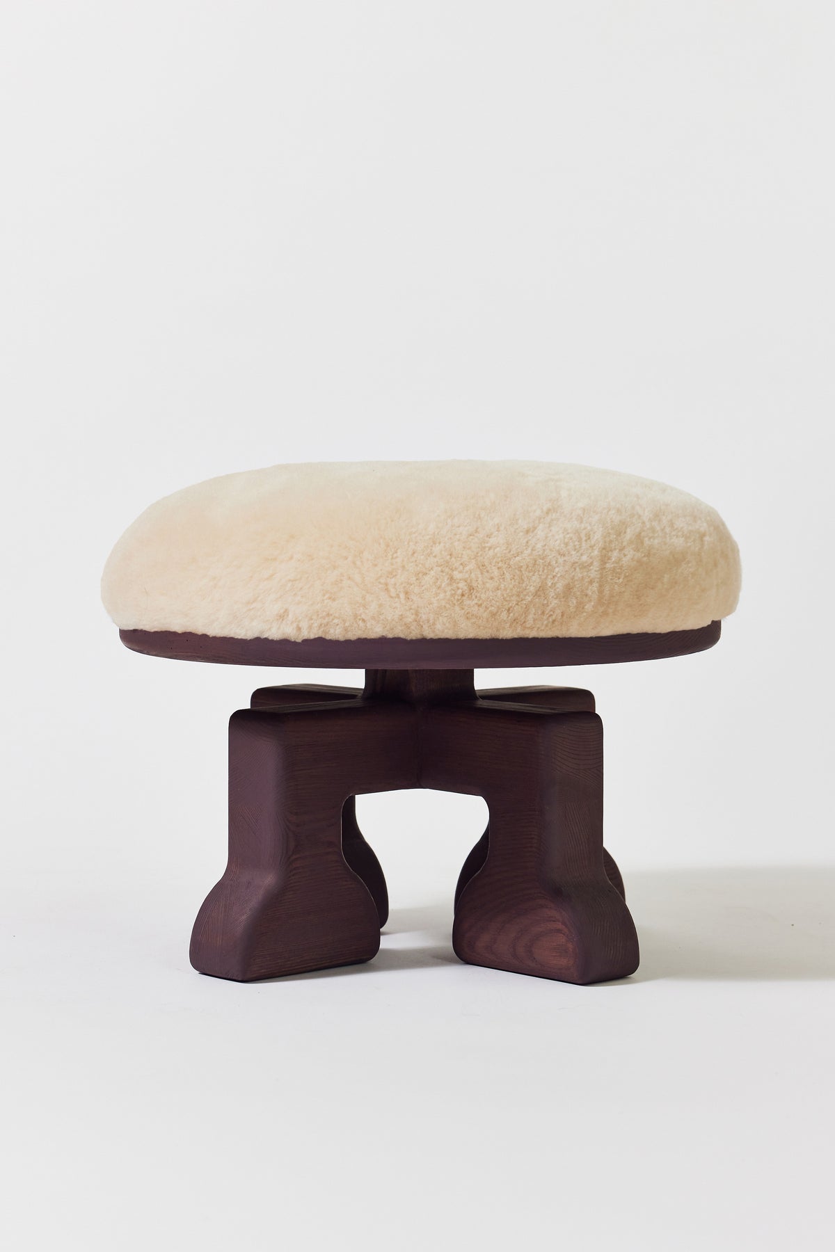 Muffin Man Stool in Eggplant Ash with putty shearling seat. Handmade solid wood stool with shearling seat by Phillip's Daughter