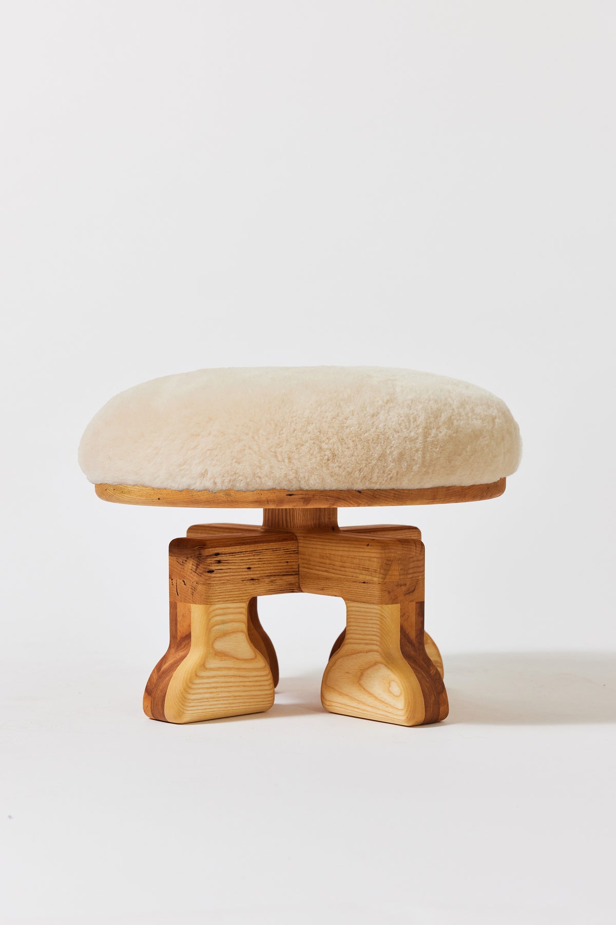 Muffin Man Stool in Natural Ash with putty shearling seat. Handmade solid wood stool with shearling seat by Phillip's Daughter