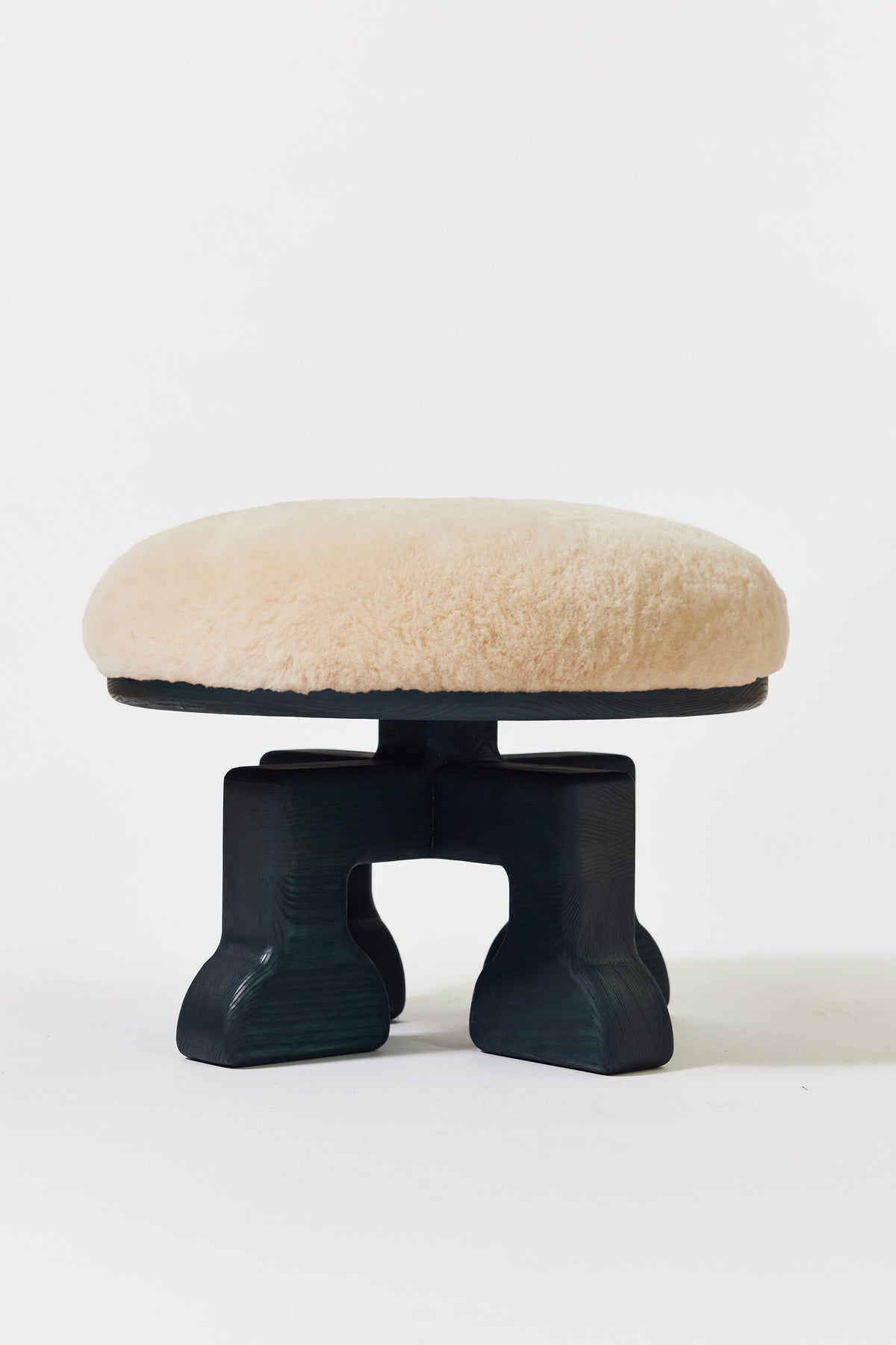 Muffin Man Stool in Midnight Green Ash with putty shearling seat. Handmade solid wood stool with shearling seat by Phillip's Daughter