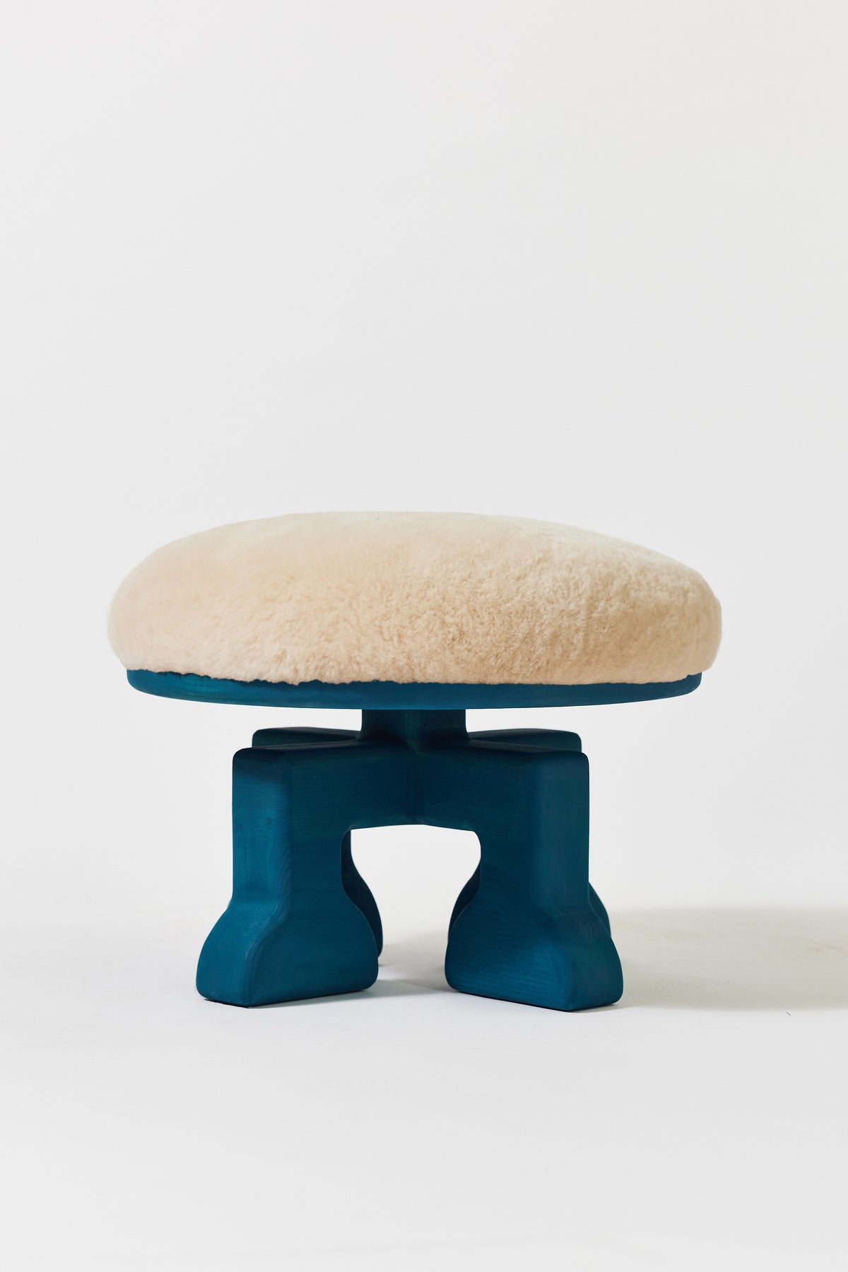 Muffin Man Stool in Peacock Blue Ash with putty shearling seat. Handmade solid wood stool with shearling seat by Phillip's Daughter