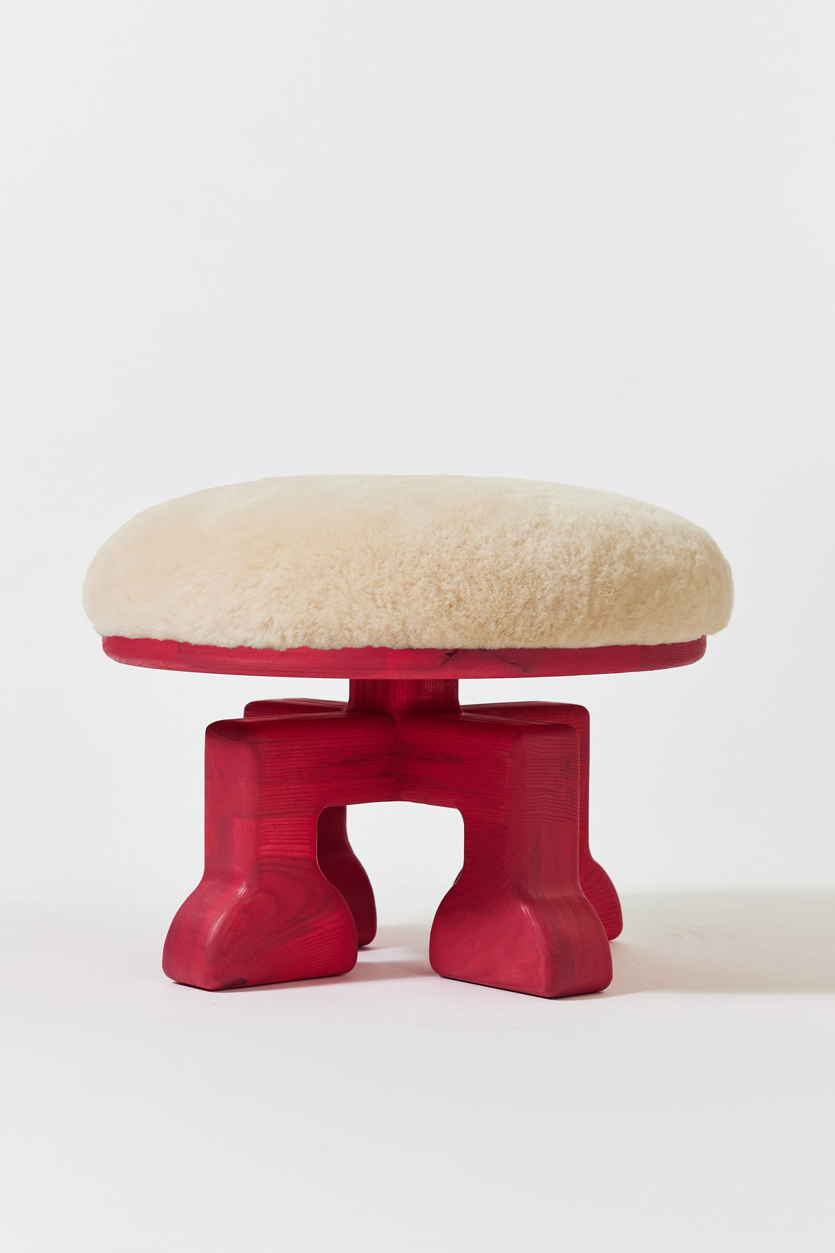 Muffin Man Stool in Raspberry Pink Ash with putty shearling seat. Handmade solid wood stool with shearling seat by Phillip's Daughter