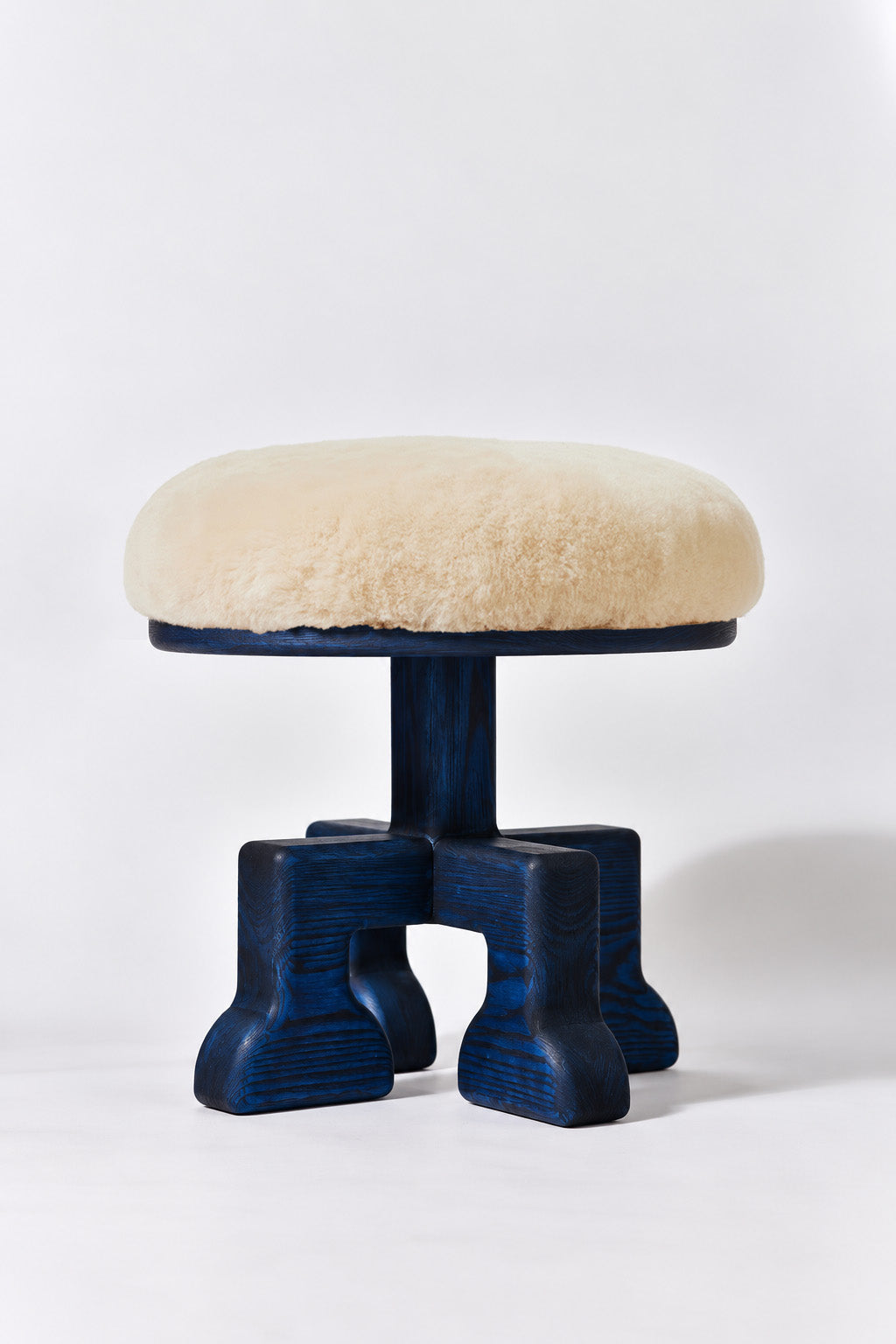 Muffin Man Tall stool in Navy Ash with putty shearling seat. Handmade tall solid wood stool with shearling seat by Phillip's Daughter