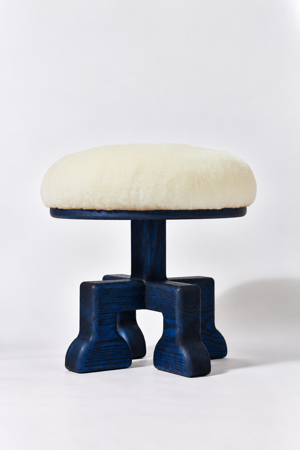 Muffin Man Tall stool in Navy Ash with white shearling seat. Handmade tall solid wood stool with shearling seat by Phillip's Daughter