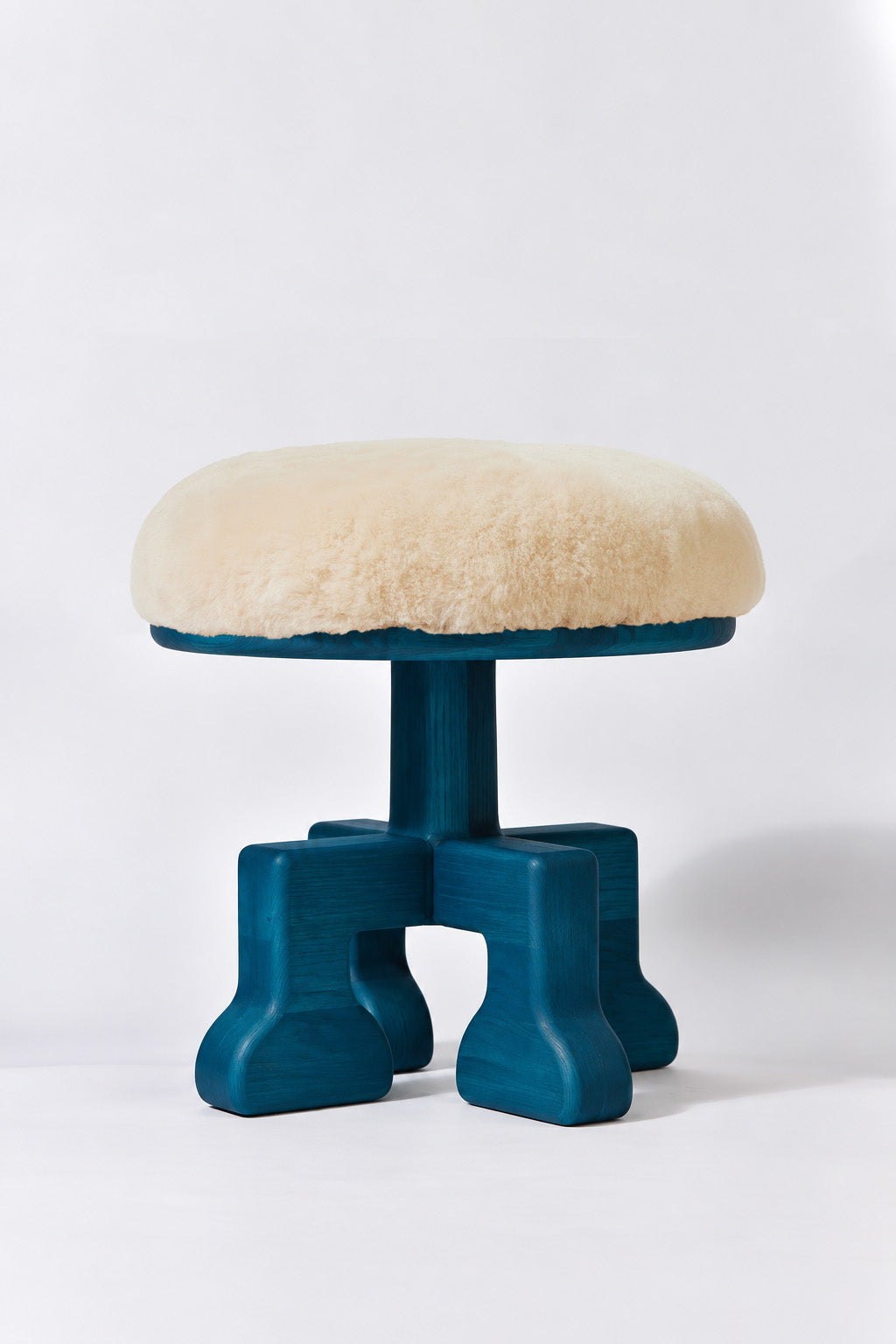 Muffin Man Tall stool in Peacock Blue Ash with putty shearling seat. Handmade tall solid wood stool with shearling seat by Phillip's Daughter