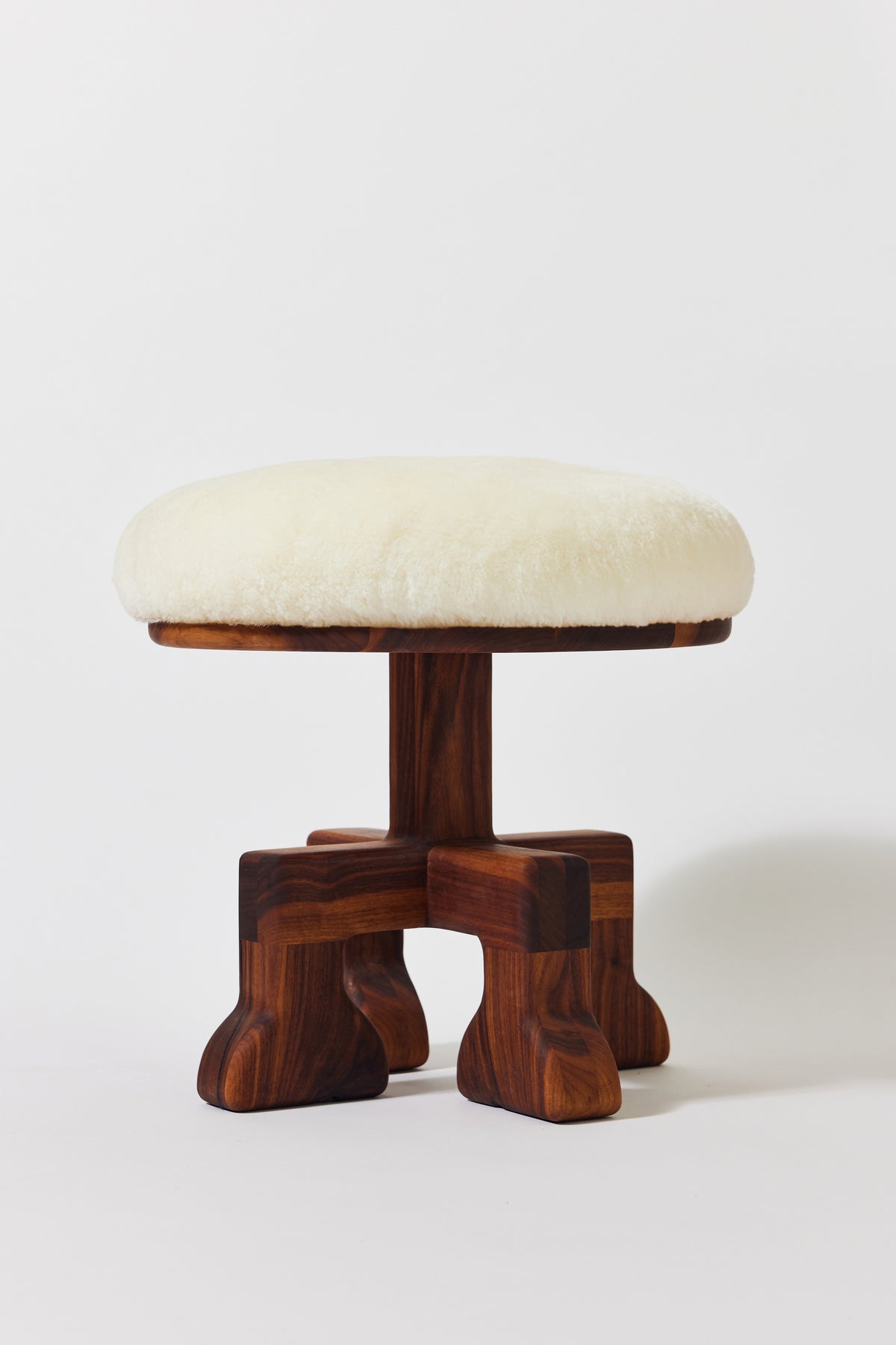 Muffin Man Tall stool in solid walnut with white shearling seat. Handmade tall solid wood stool with shearling seat by Phillip's Daughter